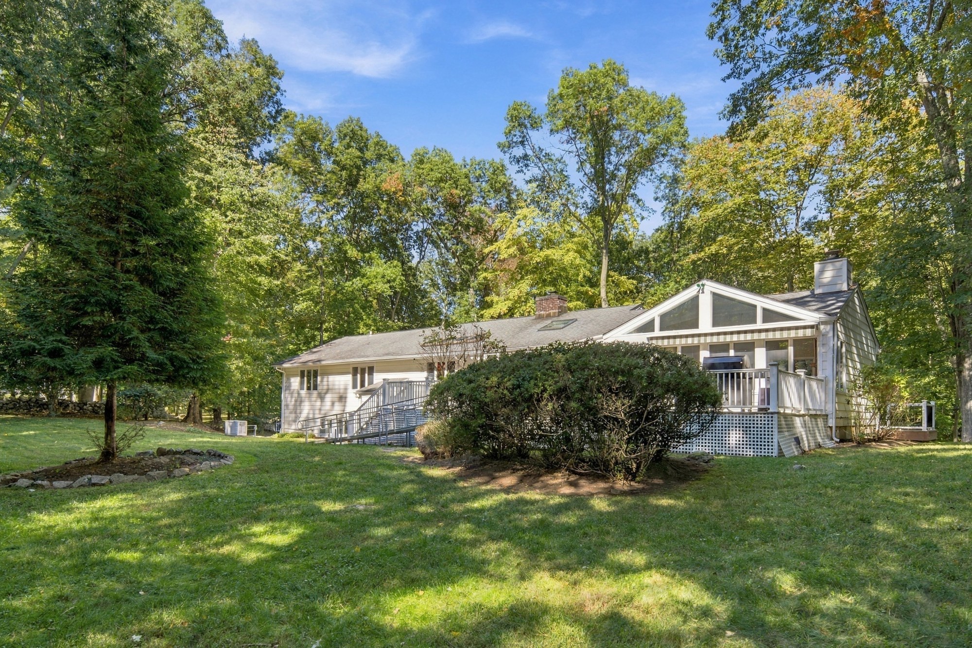 Fox Hill Road home surrounded by lawn and mature trees