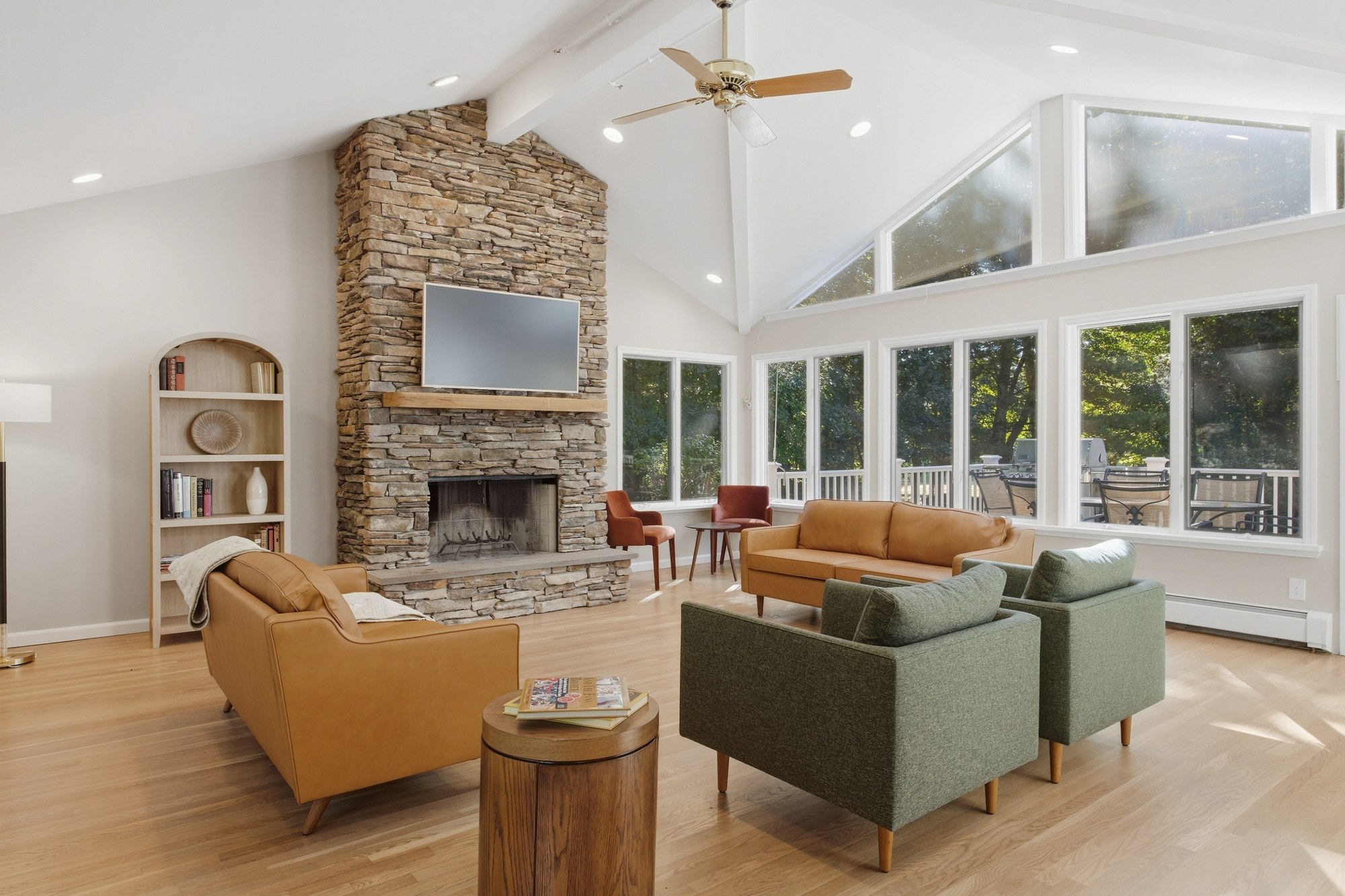 Great room with a stone fireplace and comfortable seating at Fox Hill Road
